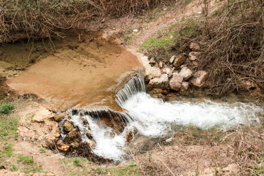 Waterfall called El Salto del Caballo and Alcaraz river crossing the natural site of Los Batanes, Alcaraz, Albacete, Spain