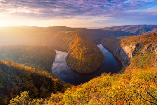 Beautiful Vyhlidka Maj, Lookout Maj, near Teletin, Czech Republic. Meander of the river Vltava surrounded by colorful autumn forest viewed from above. Tourist attraction in Czech landscape. Czechia.