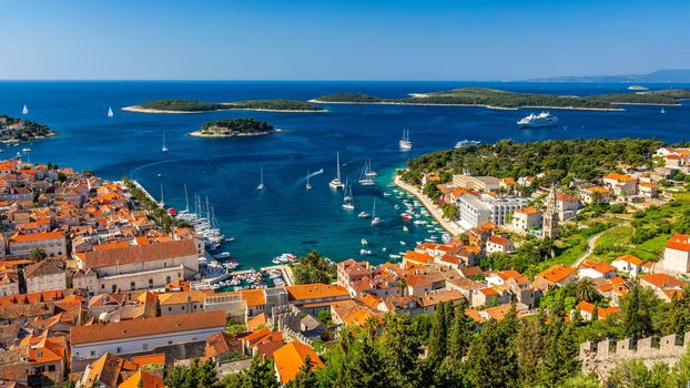 View at amazing archipelago in front of town Hvar, Croatia. Harbor of old Adriatic island town Hvar. Popular touristic destination of Croatia. Amazing Hvar city on Hvar island, Croatia.