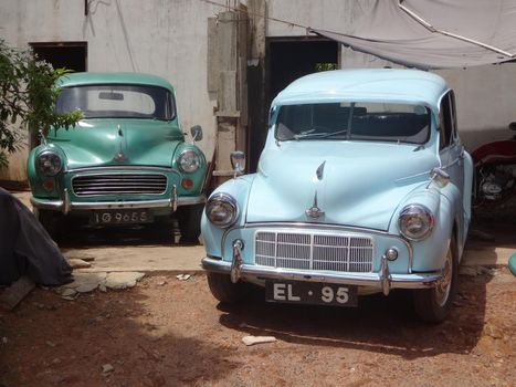 Restored Morris cars on the streets of Galle, Sri Lanka.