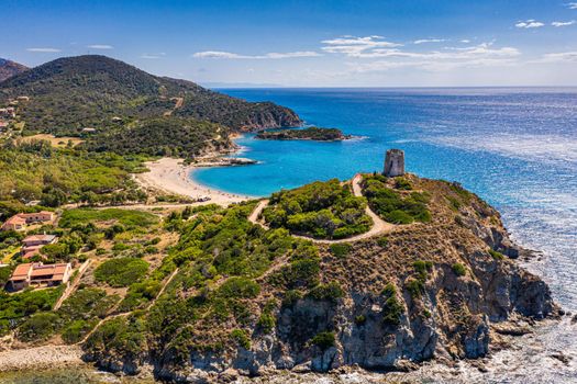 Torre di Chia view from flying drone. Acropoli di Bithia with Torre di Chia tower on background. Aerial view of Sardinia island, Italy, Europe. Panorama Of Chia Coast, Sardinia, Italy. 