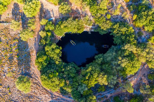 Famous Melissani lake on Kefalonia island, Karavomylos, Greece. On top of Melissani Cave (Melissani Lake) in Karavomylos village in Kefalonia island , Greece. Melissani Cave viewed from above.