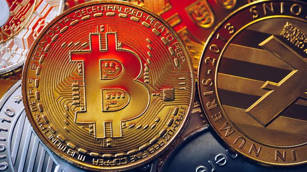 Set of cryptocurrencies with Bitcoin, Etherium, Ripple, Litecoin. Cryptocurrencys new digital money. Bitcoin on the front as the leader. Bitcoin as most important cryptocurrency.