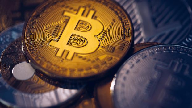 Set of cryptocurrencies with Bitcoin, Etherium, Ripple, Litecoin. Cryptocurrencys new digital money. Bitcoin on the front as the leader. Bitcoin as most important cryptocurrency.
