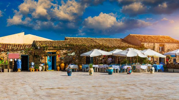 The picturesque village of Marzamemi, in the province of Syracuse, Sicily. Square of Marzamemi, a small fishing village, Siracusa province, Sicily, italy, Europe. 