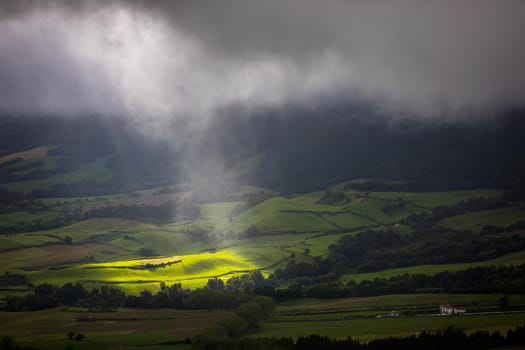 Azores panoramic view of natural landscape, wonderful scenic island of Portugal. Beautiful lagoons in volcanic craters and green fields. Tourist attraction and travel destination. Azores, Portugal.