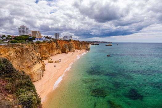 Praia dos Tres Castelos in south Portugal, Portimao, Algarve region. Landscape with Atlantic Ocean, shore and rocks in Tres Castelos beach (Praia dos Tres Castelos), Algarve, Portimao, Portugal.