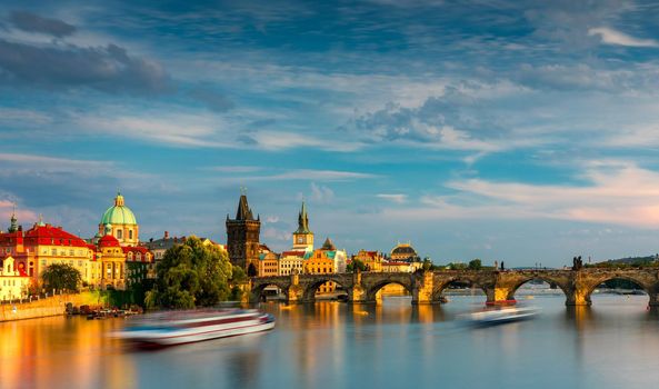 Charles Bridge in Prague in Czechia. Prague, Czech Republic. Charles Bridge (Karluv Most) and Old Town Tower. Vltava River and Charles Bridge. Concept of world travel, sightseeing and tourism.