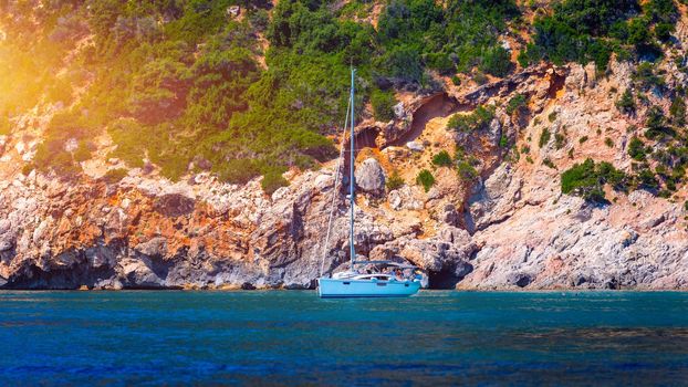 Blue sea and the characteristic caves of Cala Luna, a beach in the Golfo di Orosei, Sardinia, Italy. Big sea caves in the mediterranean coast. Sardinia, Italy.