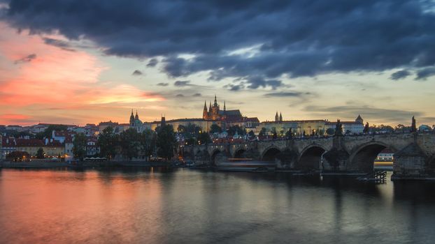 View of Prague Castle and Charles Bridge at sunset. Czechia