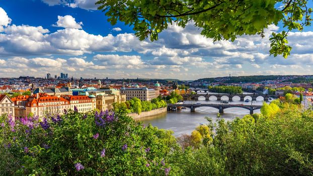 Scenic view of the Old Town pier architecture and Charles Bridge over Vltava river in Prague, Czech Republic. Prague iconic Charles Bridge (Karluv Most) and Old Town Bridge Tower at sunset, Czechia.