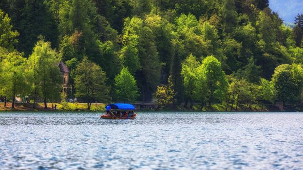 Iconic Bled scenery. Boats at lake Bled, Slovenia, Europe. Wooden boats on the Island on Lake Bled, Slovenia