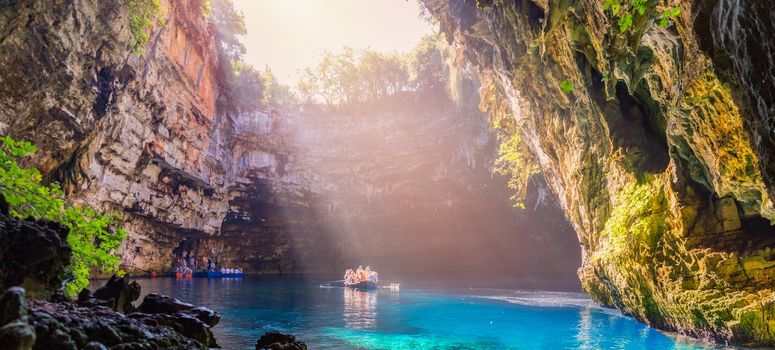 Melissani lake on Kefalonia island, Greece. Melissani Cave (Melissani Lake) near Sami village in Kefalonia island, Greece. Tourist boat on the lake in Melissani Cave, Kefalonia Island, Greece