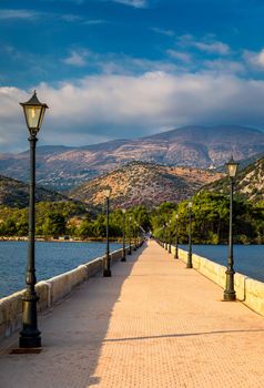 View of the De Bosset Bridge in Argostoli city on Kefalonia island. De Bosset Bridge on lakeside In Argostoli, Kefalonia. Obelisk and the de Bosset bridge in Argostoli, Kefalonia, Greece