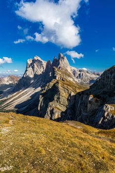View on Seceda peak. Trentino Alto Adige, Dolomites Alps, South Tyrol, Italy. Odle mountain range, Val Gardena. Majestic Furchetta peak. Odles group seen from Seceda, Santa Cristina Val Gardena.