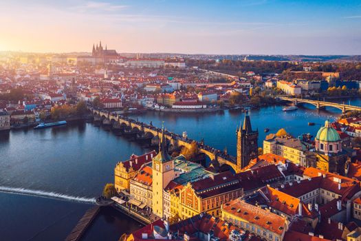 Aerial Prague panoramic drone view of the city of Prague at the Old Town Square, Czechia. Prague Old Town pier architecture and Charles Bridge over Vltava river in Prague at sunset, Czech Republic. 