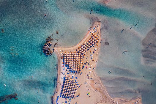 Aerial view of beautiful tropical Elafonissi Beach with pink sand. View of a nice tropical Elafonissi beach from the air. Beautiful sky, sea, resort. Elafonissi beach, Crete, Greece.