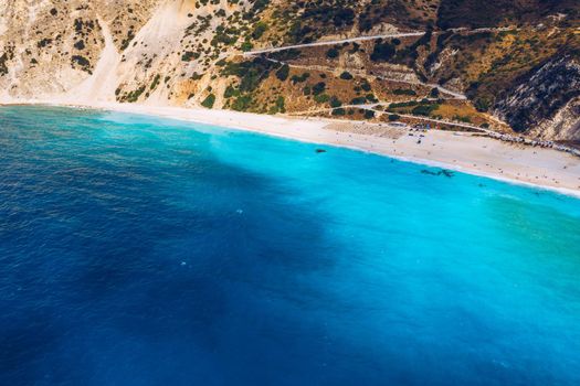 Aerial drone view of iconic turquoise and sapphire bay and beach of Myrtos, Kefalonia (Cephalonia) island, Ionian, Greece. Myrtos beach, Kefalonia island, Greece. Beautiful view of Myrtos beach.