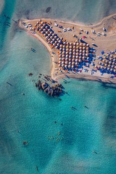 Aerial view of beautiful tropical Elafonissi Beach with pink sand. View of a nice tropical Elafonissi beach from the air. Beautiful sky, sea, resort. Elafonissi beach, Crete, Greece.