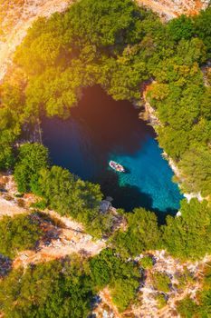 Famous Melissani lake on Kefalonia island, Karavomylos, Greece. On top of Melissani Cave (Melissani Lake) in Karavomylos village in Kefalonia island , Greece. Melissani Cave viewed from above.