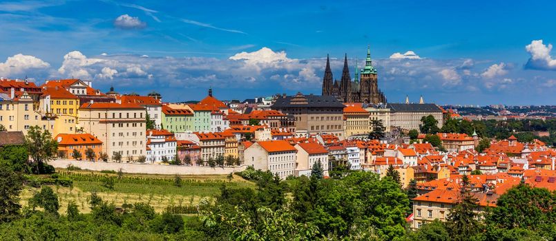 Prague in a sunny day, view of the old town, Prague, Czech Republic. Scenic summer view of the Old Town pier architecture and Charles Bridge over Vltava river in Prague, Czech Republic