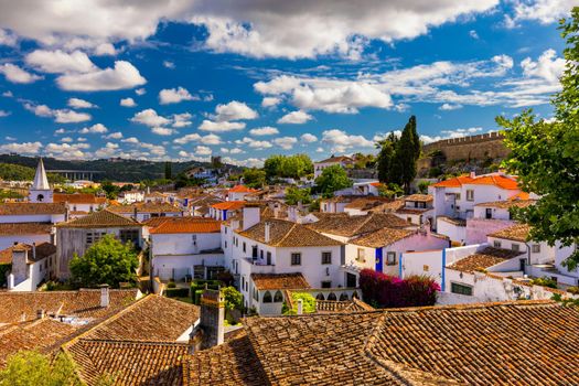 Obidos, Portugal stonewalled city with medieval fortress, historic walled town of Obidos, near Lisbon, Portugal. Beautiful view of Obidos Medieval Town, Portugal. 