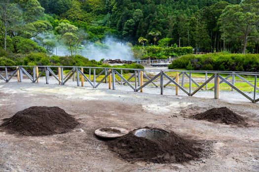 Cooking of Cozido Das Furnas meal, Sao Miguel, Azores. Hole in the ground for cooking Cozido das Furnas, a meat stew cooked by the volcanic steam from Furnas Lake, Sao Miguel, Azores, Portugal. 
