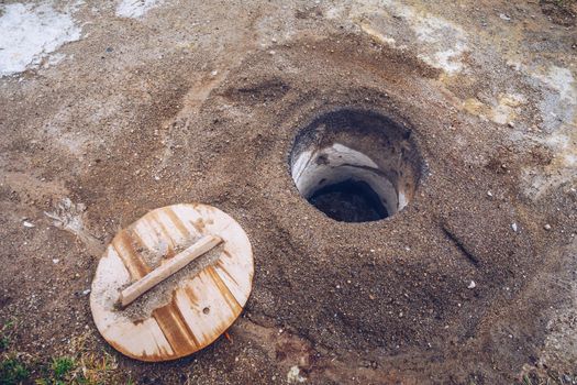 Cooking of Cozido Das Furnas meal, Sao Miguel, Azores. Hole in the ground for cooking Cozido das Furnas, a meat stew cooked by the volcanic steam from Furnas Lake, Sao Miguel, Azores, Portugal. 