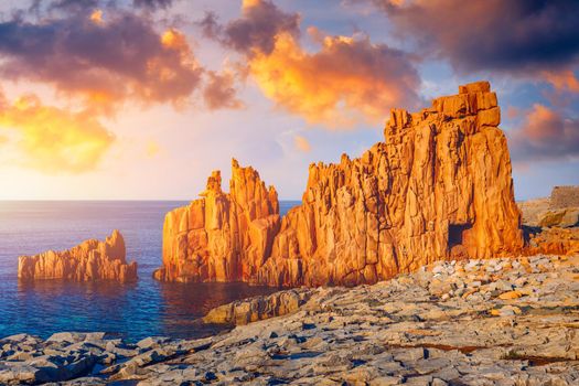 Red Rocks (called "Rocce Rosse") of Arbatax, Sardinia, Italy. Arbatax with the known red porphyry rocks nearby the port at the Capo Bellavista, Sardinia, Italy