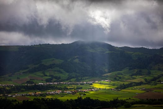 Azores panoramic view of natural landscape, wonderful scenic island of Portugal. Beautiful lagoons in volcanic craters and green fields. Tourist attraction and travel destination. Azores, Portugal.