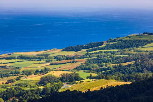 Azores panoramic view of natural landscape, wonderful scenic island of Portugal. Beautiful lagoons in volcanic craters and green fields. Tourist attraction and travel destination. Azores, Portugal.