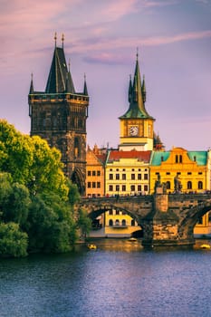 Charles Bridge in Prague in Czechia. Prague, Czech Republic. Charles Bridge (Karluv Most) and Old Town Tower. Vltava River and Charles Bridge. Concept of world travel, sightseeing and tourism.