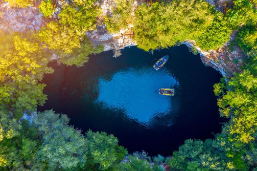 Famous Melissani lake on Kefalonia island, Karavomylos, Greece. On top of Melissani Cave (Melissani Lake) in Karavomylos village in Kefalonia island , Greece. Melissani Cave viewed from above.