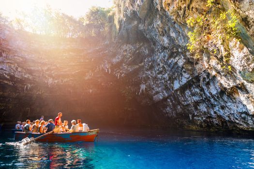 Melissani lake on Kefalonia island, Greece. Melissani Cave (Melissani Lake) near Sami village in Kefalonia island, Greece. Tourist boat on the lake in Melissani Cave, Kefalonia Island, Greece