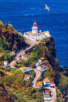 Dramatic view down to lighthouse on Ponta do Arnel, Nordeste, Sao Miguel Island, Azores, Portugal. Lighthouse Arnel near Nordeste on Sao Miguel Island, Azores, Portugal. 