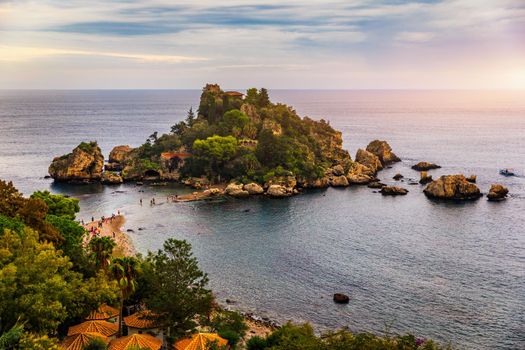 Aerial view of Isola Bella in Taormina, Sicily, Italy. Isola Bella is small island near Taormina, Sicily, Italy. Narrow path connects island to mainland Taormina beach in azure waters of Ionian Sea. 