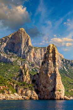 The monolith of Pedra Longa, Baunei, province of Ogliastra, East Sardinia, Italy. The rocky spire which rises majestically out of the sea. Holidays in Sardinia, Italy.