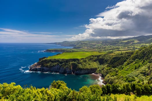 Azores panoramic view of natural landscape, wonderful scenic island of Portugal. Beautiful lagoons in volcanic craters and green fields. Tourist attraction and travel destination. Azores, Portugal.