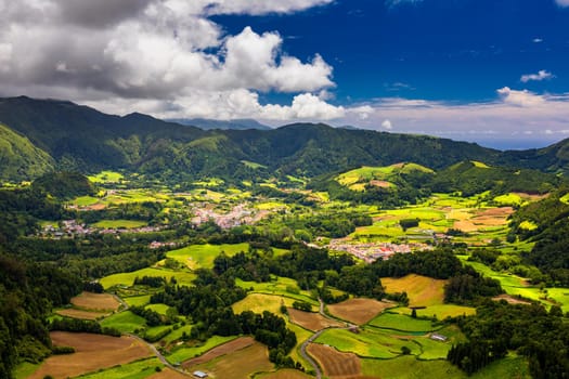 Aerial view of Lagoa das Furnas located on the Azorean island of Sao Miguel, Azores, Portugal. Lake Furnas (Lagoa das Furnas) on Sao Miguel, Azores, Portugal from the Pico do Ferro scenic viewpoint.