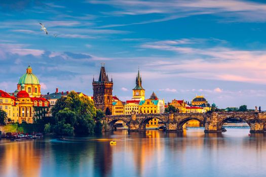 Charles Bridge in Prague in Czechia. Prague, Czech Republic. Charles Bridge (Karluv Most) and Old Town Tower. Vltava River and Charles Bridge. Concept of world travel, sightseeing and tourism.