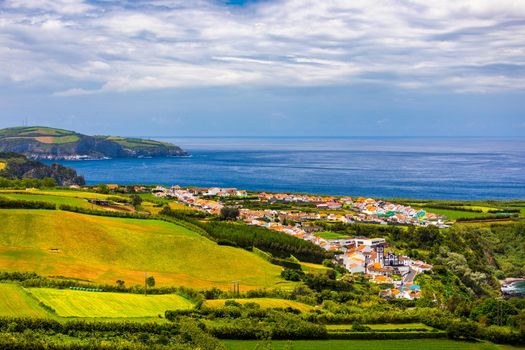Beautiful nature view on Azores with small villages, tows, green nature fields. Amazing Azores. View of typical Azores village in Sao Miguel island, Azores, Portugal.