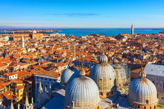 Venice panoramic aerial view with red roofs, Veneto, Italy. Aerial view of the Venice city, Italy. Venice is a popular tourist destination of Europe. Venice, Italy.