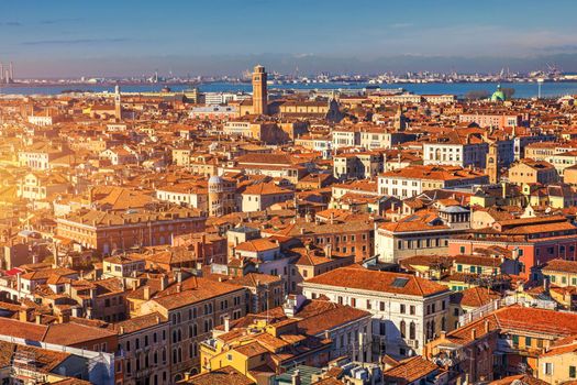 Venice panoramic aerial view with red roofs, Veneto, Italy. Aerial view with dense medieval red roofs of Venice, Italy 