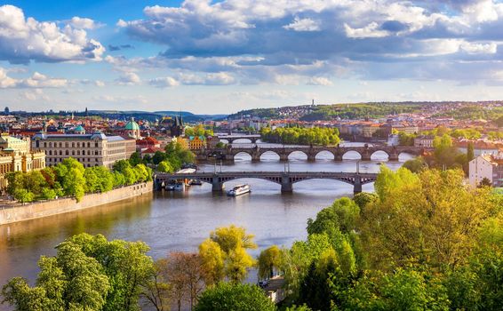Old town of Prague. Czech Republic over river Vltava with Charles Bridge on skyline. Prague panorama landscape view with red roofs.  Prague view from Letna Park, Prague, Czechia.