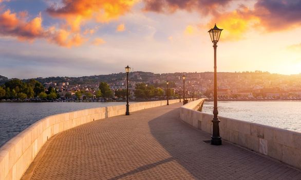 View of the De Bosset Bridge in Argostoli city on Kefalonia island. De Bosset Bridge on lakeside In Argostoli, Kefalonia. Obelisk and the de Bosset bridge in Argostoli, Kefalonia, Greece