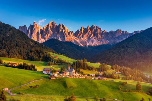 Santa Maddalena (Santa Magdalena) village with magical Dolomites mountains in background, Val di Funes valley, Trentino Alto Adige region, South Tyrol, Italy, Europe. Santa Maddalena Village, Italy. 