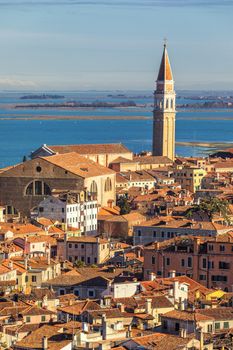 Venice panoramic aerial view with red roofs, Veneto, Italy. Aerial view of the Venice city, Italy. Venice is a popular tourist destination of Europe. Venice, Italy.