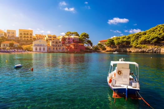 Assos village in Kefalonia, Greece. Turquoise colored bay in Mediterranean sea with beautiful colorful houses in Assos village in Kefalonia, Greece, Ionian island, Cephalonia, Assos village.