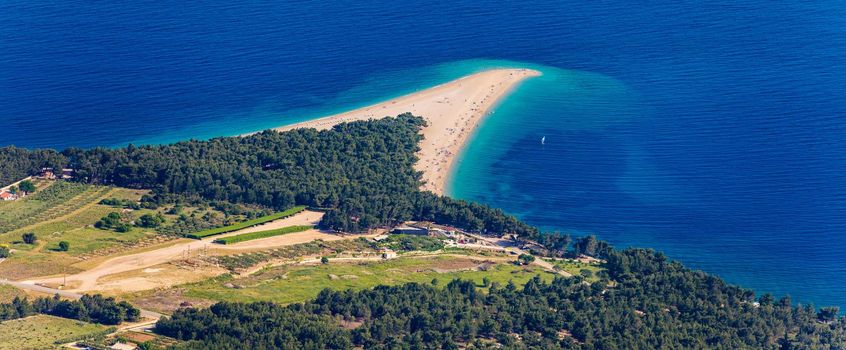 Zlatni Rat (Golden Cape or Golden Horn) famous turquoise beach in Bol town on Brac island, Dalmatia, Croatia. Zlatni Rat sandy beach at Bol on Brac island of Croatia in summertime.