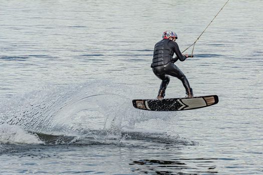 Spain, Tenerife Island - May 27, 2021: Sports. The kitesurfer sat down on the board. Stock photography.